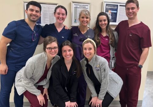 Dr. Rogers (center back row) with this fun and enthusiastic group of youg Dermatology Residents from nearby Louisiana State University (LSU)